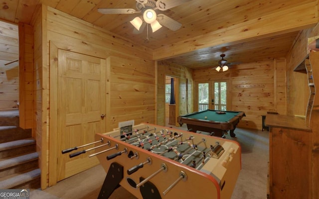 rec room featuring wooden walls, french doors, light colored carpet, and billiards