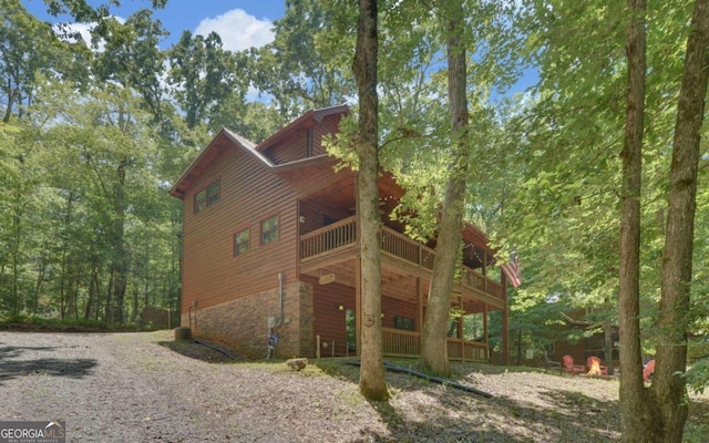 view of side of property with a balcony