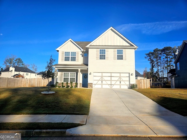 view of front of home featuring a garage and a front lawn