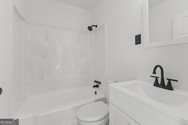 bathroom featuring toilet, vanity, and bathing tub / shower combination