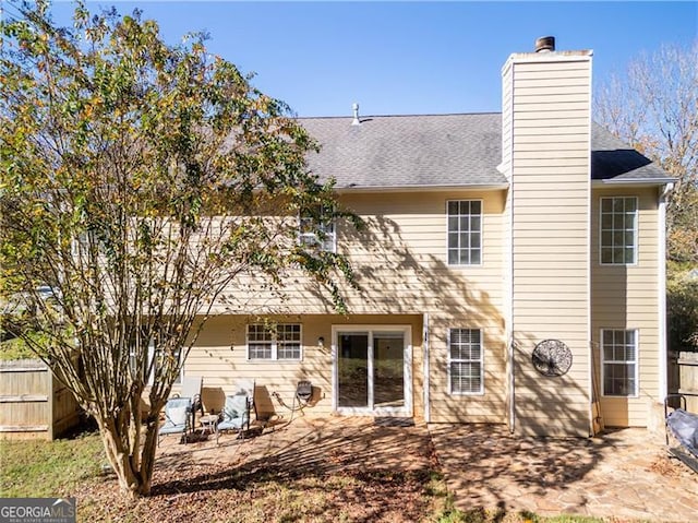 back of house with a patio