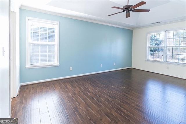 spare room with ceiling fan, plenty of natural light, dark hardwood / wood-style floors, and ornamental molding