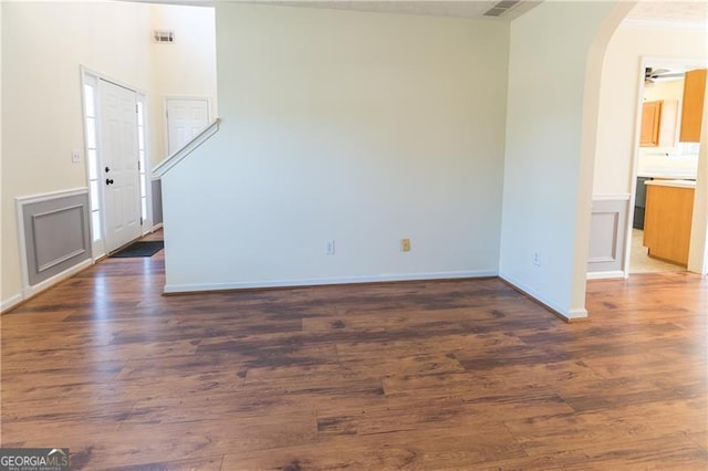 unfurnished room featuring ceiling fan and dark hardwood / wood-style flooring