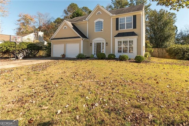 view of front of home featuring a front lawn and a garage