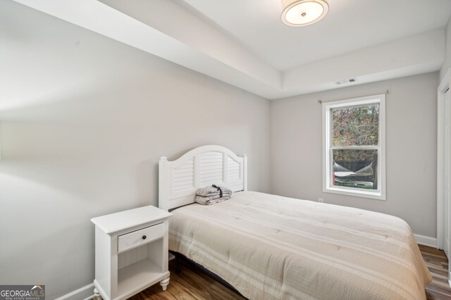 bedroom with hardwood / wood-style floors