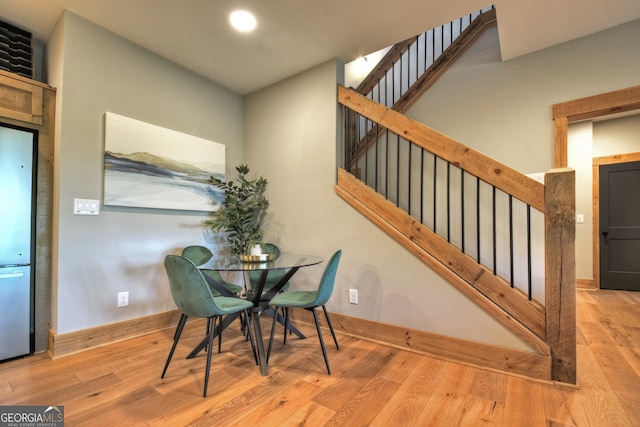 dining area with light hardwood / wood-style floors