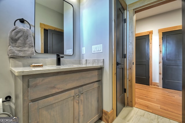 bathroom featuring vanity and hardwood / wood-style flooring