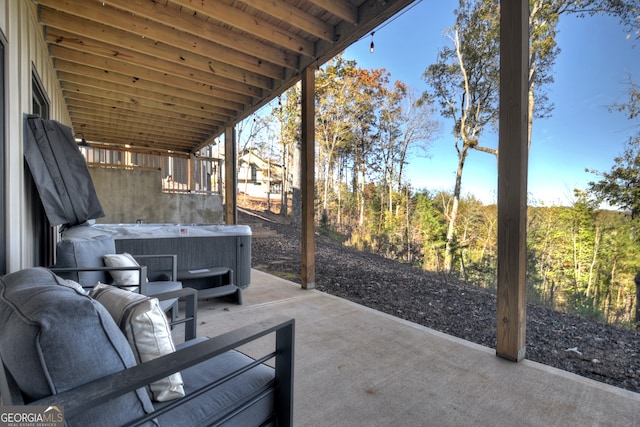 view of patio / terrace with a hot tub