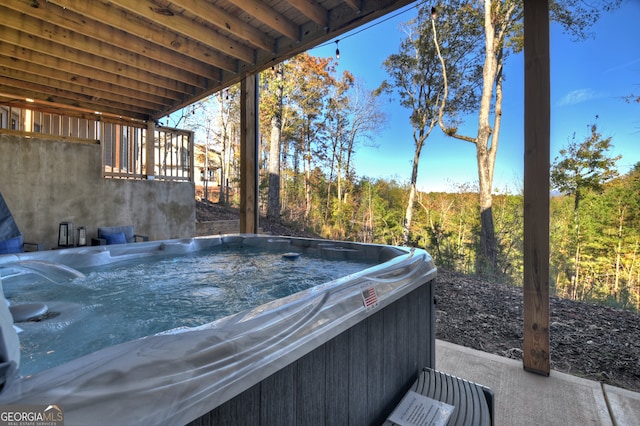 view of patio / terrace with a hot tub