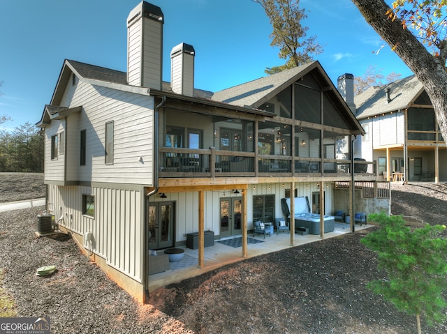 back of property featuring central air condition unit, a patio area, and french doors