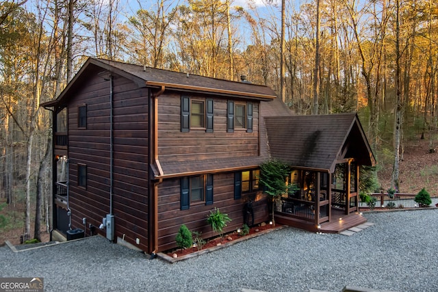 view of front of property with a wooden deck