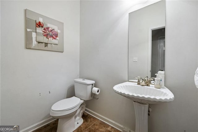 bathroom with tile patterned floors and toilet