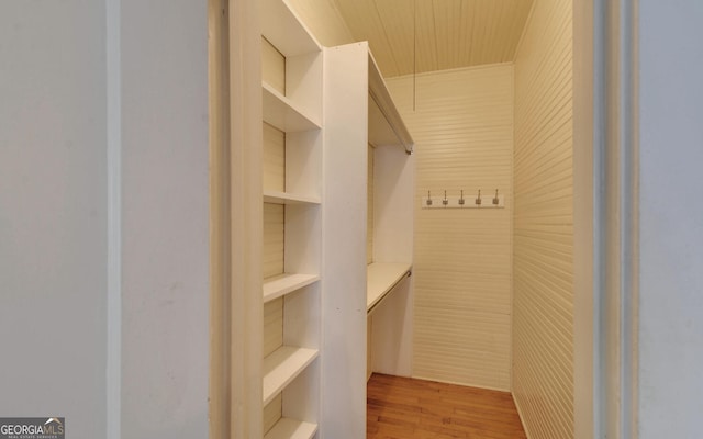 walk in closet featuring light hardwood / wood-style flooring