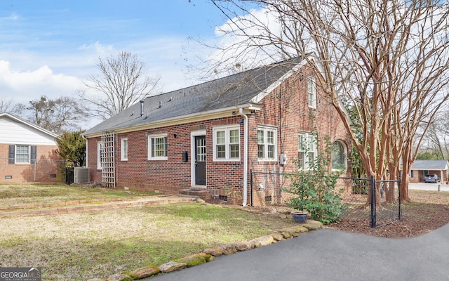 view of front of house featuring a front yard and cooling unit