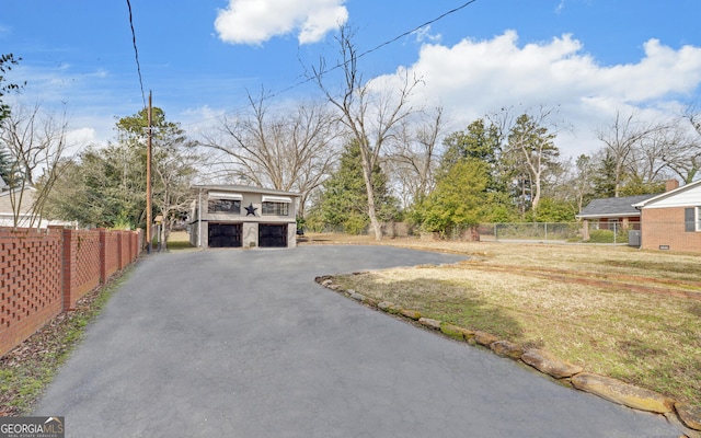 view of yard with a carport and central air condition unit