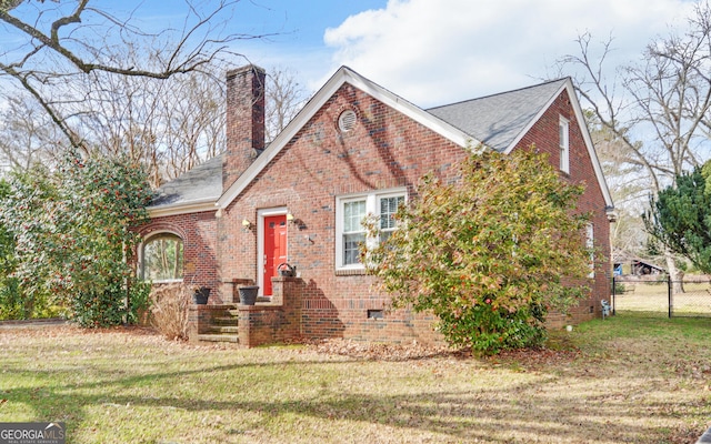 tudor house with a front yard