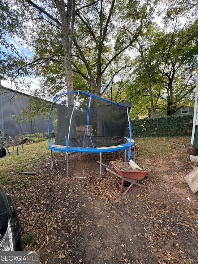 view of yard with a trampoline