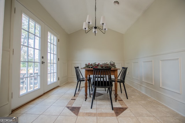 dining space featuring a wealth of natural light, french doors, and light tile patterned flooring