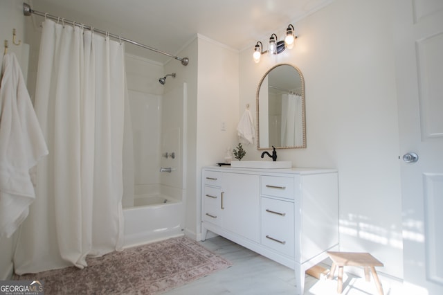 bathroom featuring vanity, shower / tub combo, and ornamental molding