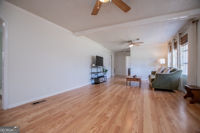 living room featuring a textured ceiling, ceiling fan, crown molding, and light hardwood / wood-style flooring