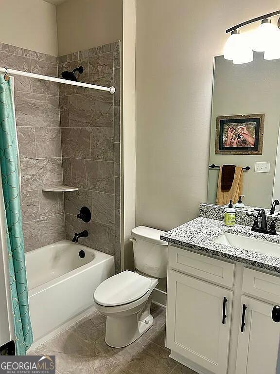 full bathroom featuring toilet, vanity, and shower / tub combo with curtain