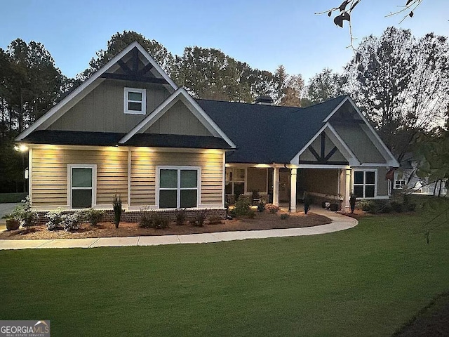 craftsman-style home with a front yard