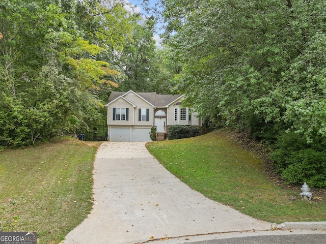 view of front of home featuring a garage and a front yard