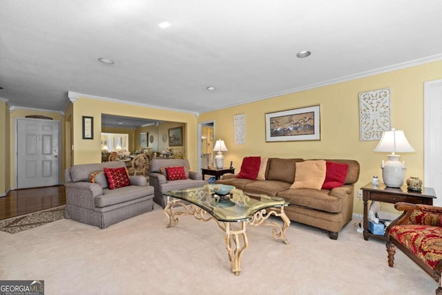 carpeted living room featuring crown molding