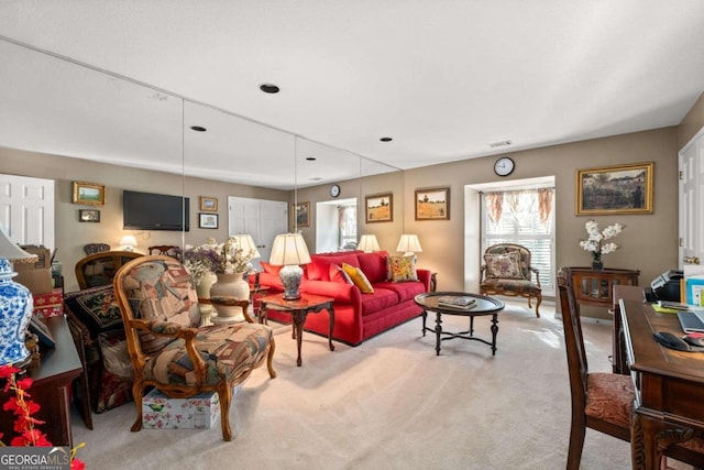 living room featuring light colored carpet