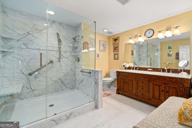 bathroom featuring vanity, toilet, and walk in shower