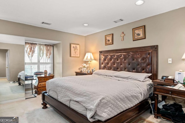 bedroom featuring light carpet