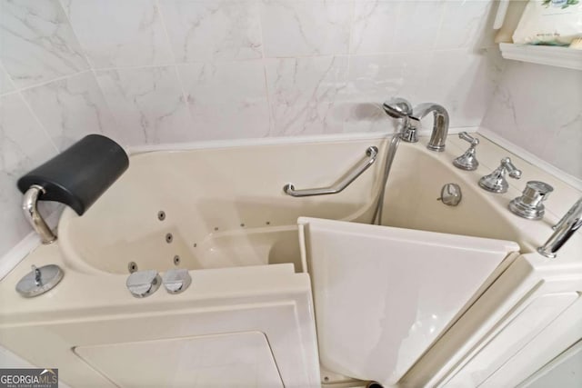 bathroom with a washtub