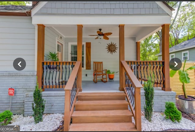 entrance to property with ceiling fan and covered porch