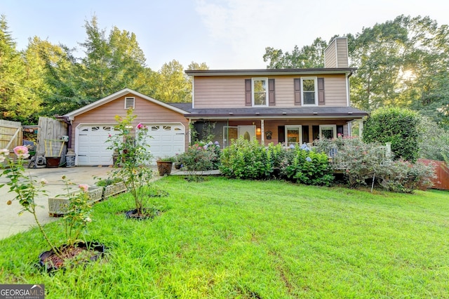 view of front of home featuring a front yard and a garage