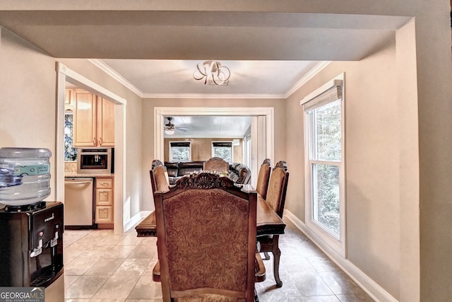 dining space with ceiling fan, crown molding, and light tile patterned floors