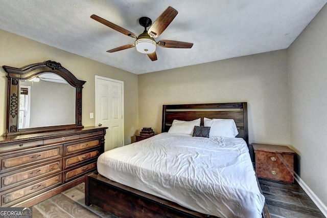 bedroom with ceiling fan and hardwood / wood-style floors