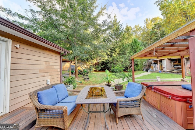 wooden terrace with a lawn and a hot tub