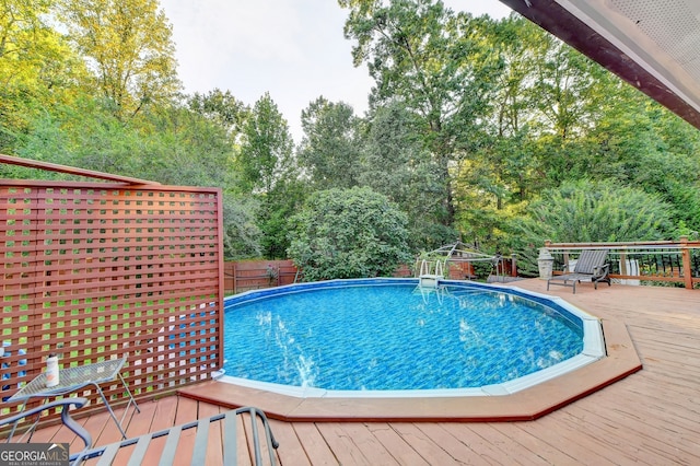 view of pool featuring a deck