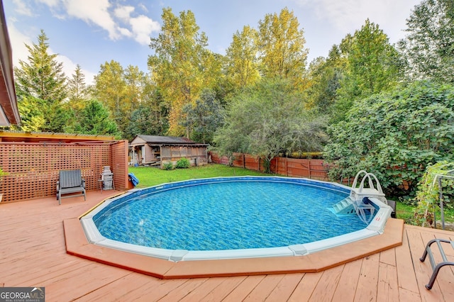 view of pool with a wooden deck