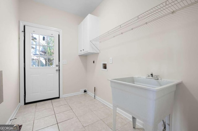 laundry area with cabinets, hookup for a washing machine, hookup for a gas dryer, and light tile patterned flooring