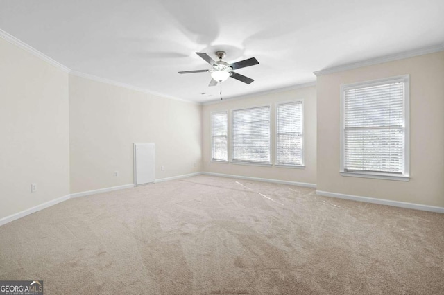 empty room with light carpet, plenty of natural light, and ornamental molding