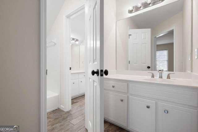 bathroom with vanity and wood-type flooring