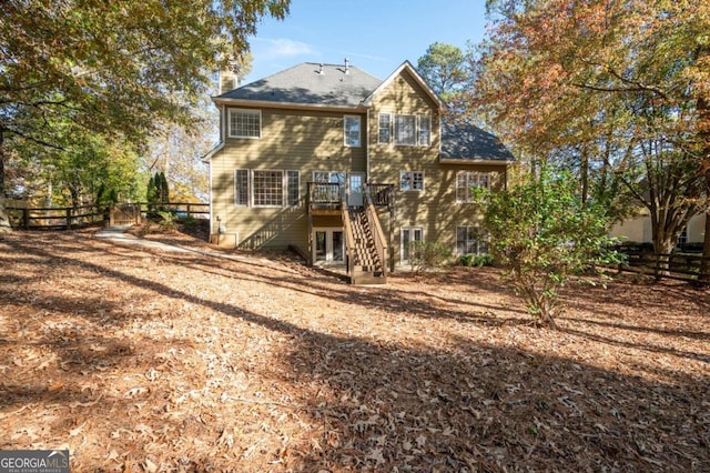 back of house featuring a deck