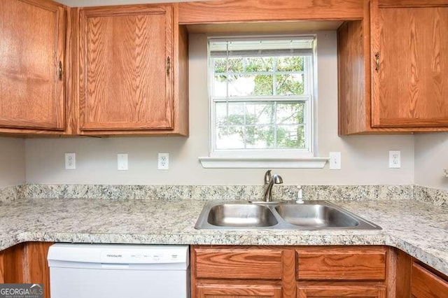 kitchen with sink and white dishwasher