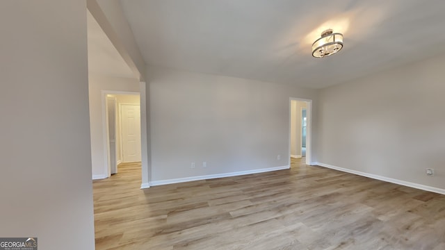 corridor with light hardwood / wood-style floors