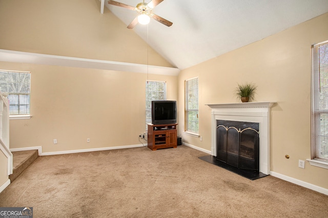 unfurnished living room featuring carpet flooring, ceiling fan, and high vaulted ceiling