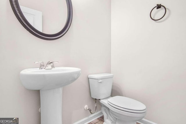 bathroom with sink and toilet