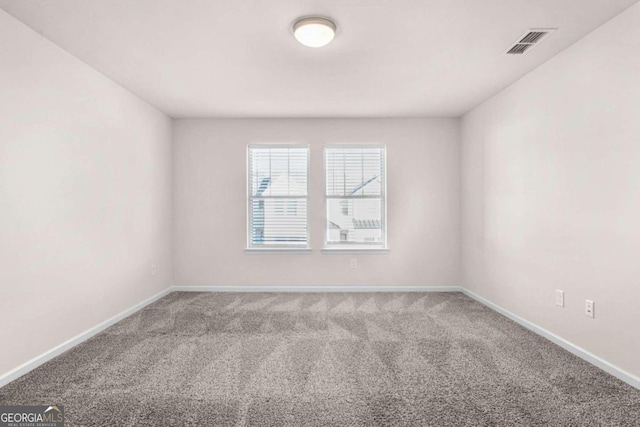 empty room with carpet floors