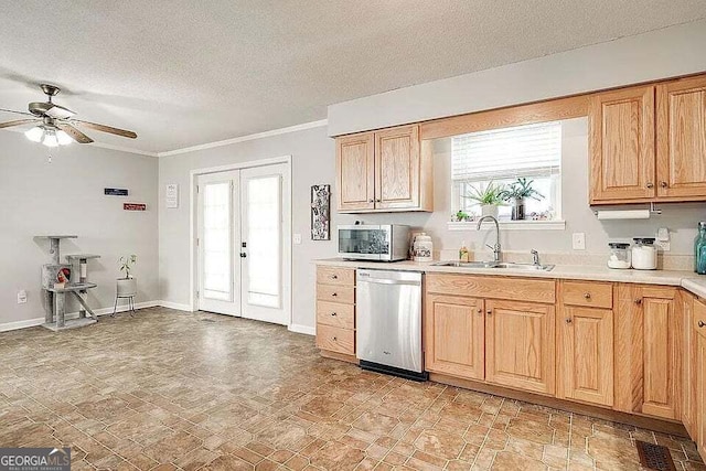 kitchen with ceiling fan, sink, stainless steel appliances, crown molding, and a textured ceiling