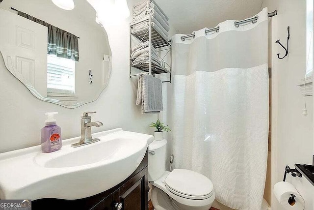 bathroom with vanity and toilet